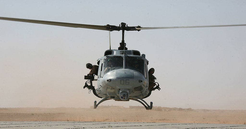 A UH-1 Huey with Marine Light Attack Helicopter Squadron 269 touches down at a remote helicopter landing pad in al Anbar province to refuel Oct. 9 during a scouting mission. (Photo from U.S. Marine Corps)