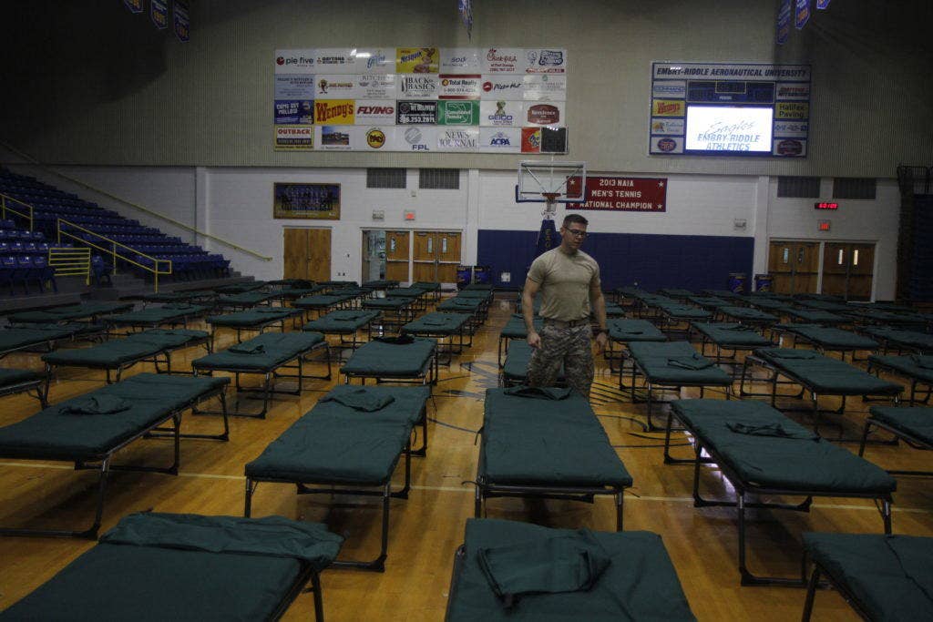 2nd Lt Robbie Morris from second battalion 124th infantry regiment assembles cots at the ICI Center atEmbry-Riddle Aeronautical University in Daytona Beach, Fla. Soldiers and civilians joined together to provide assistance to civil authorities in response to Hurricane Matthew. (U.S. Army photos by Spc James Lanza)