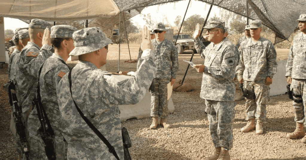 Maj. Gen. William H. Wade, the adjutant general for the California National Guard administers the oath of enlistment to Soldiers of Bravo Battery, 1st Battalion, 143rd Field Artillery during a recent visit Victory Base Complex, Iraq in 2007.