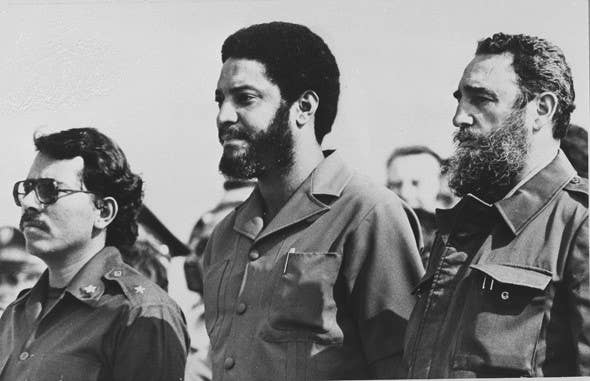 Maurice Bishop (center) with Cuban leader Fidel Castro (right).