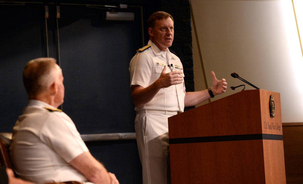 Adm. Michael S. Rogers, commander, U.S. Cyber Command, director, National Security Agency, chief, Central Security Service, provides a keynote address to students, staff, faculty and guests during a convocation ceremony kicking-off the 2015-2016 school year at NWC in Nepwort, Rhode Island. During the ceremony, Rogers provided a keynote address and was presented NWC's 2015 Distinguished Graduate Leadership Award. The award honors NWC graduates who have earned positions of prominence in the national defense field. (U.S. Navy photo by Chief Mass Communication Specialist James E. Foehl/Released)