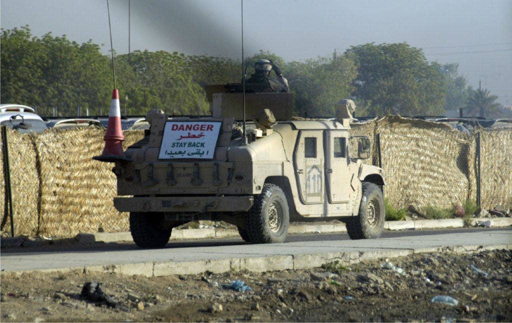 A Humvee in Sadiyah. The other side of the wall is Route Irish. (Photo by Matthew Vea)