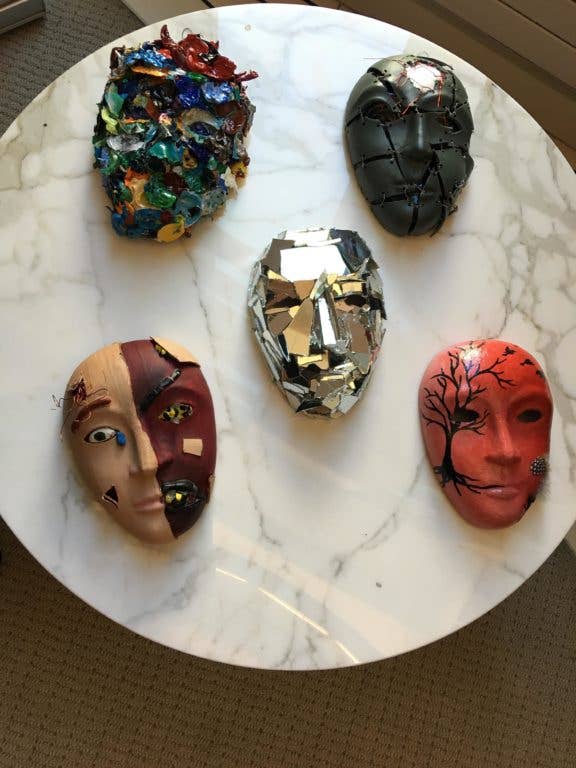 Masks, decorated by service members, sit on display as part of the Creative Forces: NEA Military Healing Arts Network at the National Intrepid Center of Excellence in Bethesda, Md., Oct. 21, 2016. (National Endowment for the Arts courtesy photo)