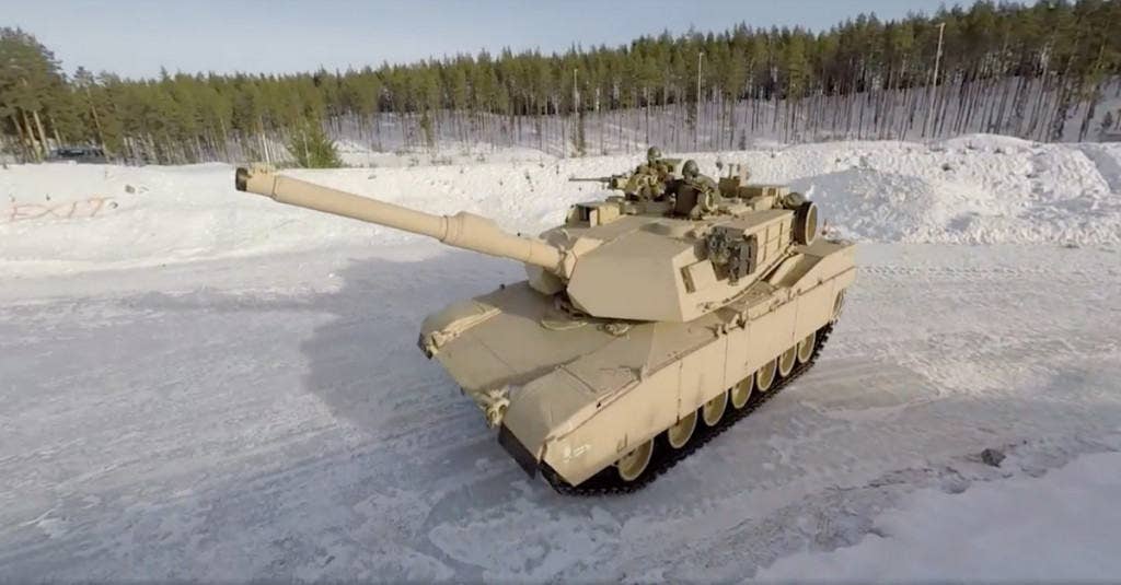A U.S. Marine drifts a tank on ice during training in Norway. (Photo: YouTube/Marines)