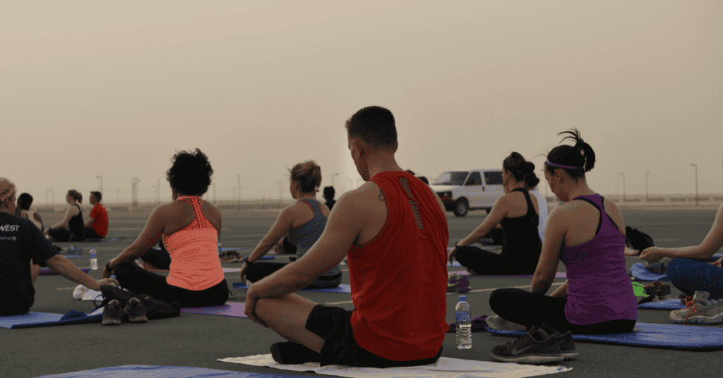 Deployed Soldiers, sailors, airmen, Marines, coalition partners and civilians go relax as they finish the largest Yoga session to take place in Qatar history July 11, 2015 at Al Udeid Air Base, Qatar.