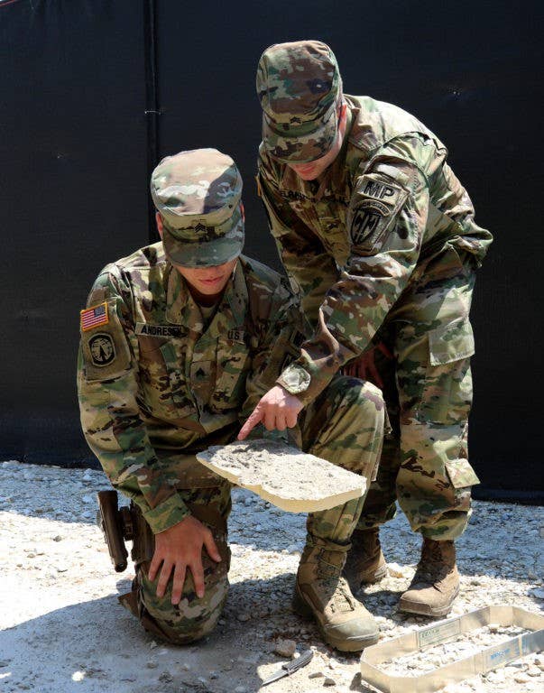 Military police analyze a foot impression during training at Camp Bondsteel, Kosovo, on July 13, 2016. (Photo: U.S. Army photo Staff Sgt. Thomas Duval)