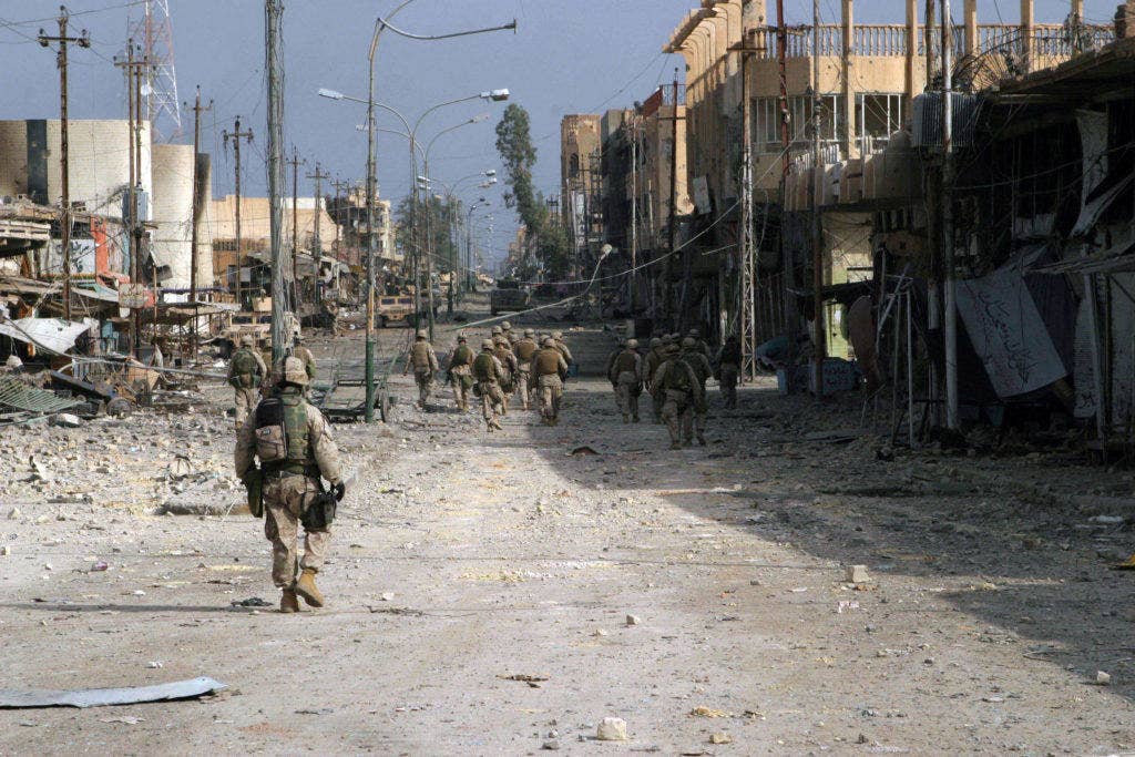 Fallujah, Iraq (Nov. 15, 2004) - Iraqi Special Forces Soldiers assigned to the U.S. Marines of 2nd Squad, 3rd Platoon, L Company, 3rd Battalion, 5th Marine Regiment, 1st Marine Division, patrol south clearing every house on their way through Fallujah, Iraq, during Operation Al Fajr (New Dawn). Operation Al Fajr is an offensive operation to eradicate enemy forces within the city of Fallujah in support of continuing security and stabilization operations in the Al Anbar province of Iraq by units of the 1st Marine Division. (U.S. Marine Corps photo by Lance Cpl. James J. Vooris.)