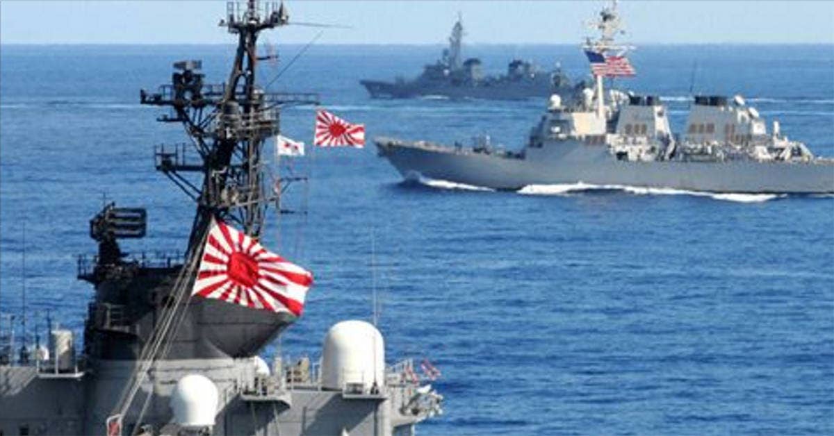 Japan snaps surveillance pics of Chinese navy carrier battle group