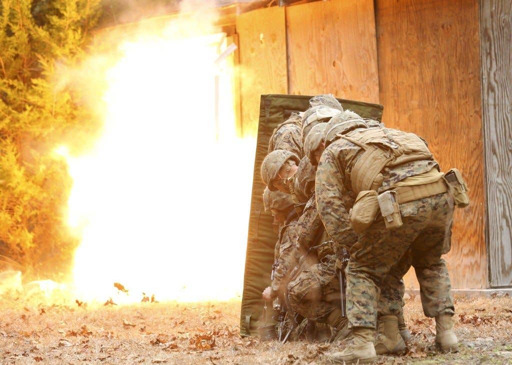 The engineers use controlled detonations to get rid of buildings. It looks kind of like this except, instead of just the door blowing up, everything blows up. (Photo: U.S. Marine Corps Cpl. Justin T. Updegraff)