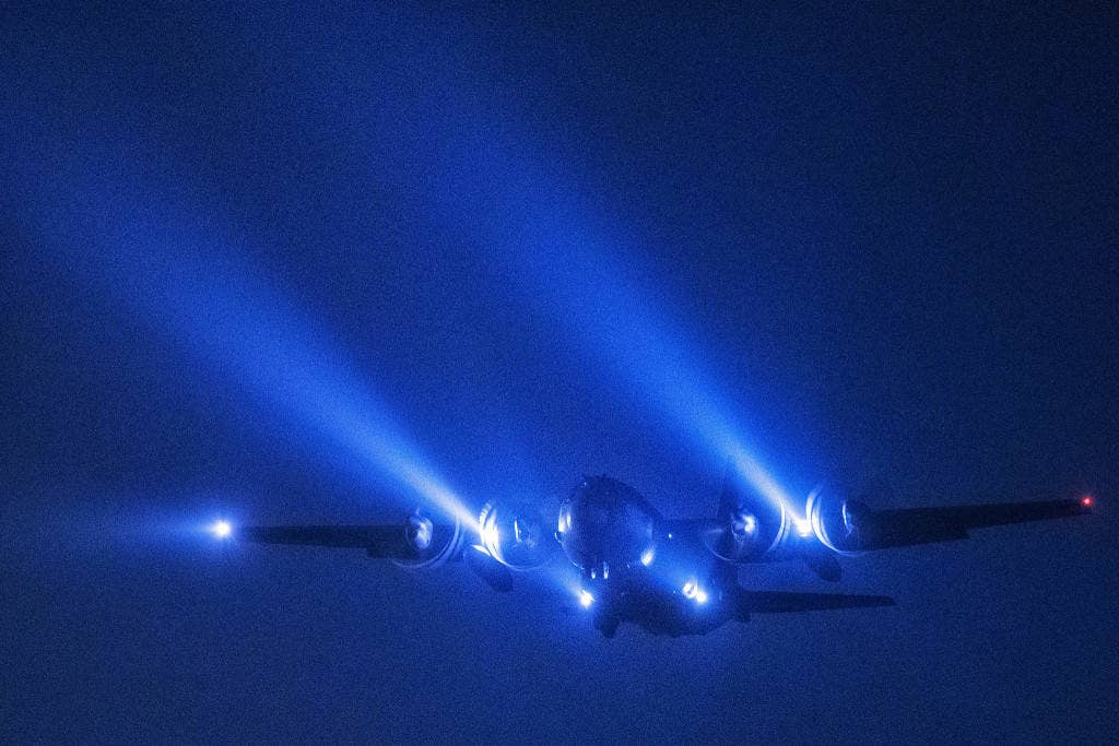 A C-130 Hercules from the 36th Airlift Squadron conducts a night flight mission over Yokota Air Base. | U.S. Air Force photo by Yasuo Osakabe