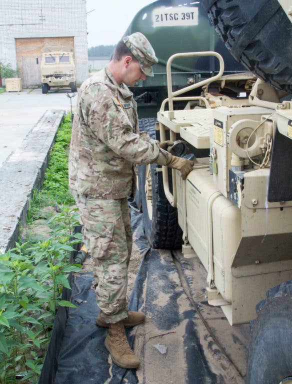 This guy is inspecting the inside of the gas tank. Instead, look inside the gas tank when you refill it and use the time you save during inspection to nap. (Photo: U.S. Army Pfc. James Dutkavich)