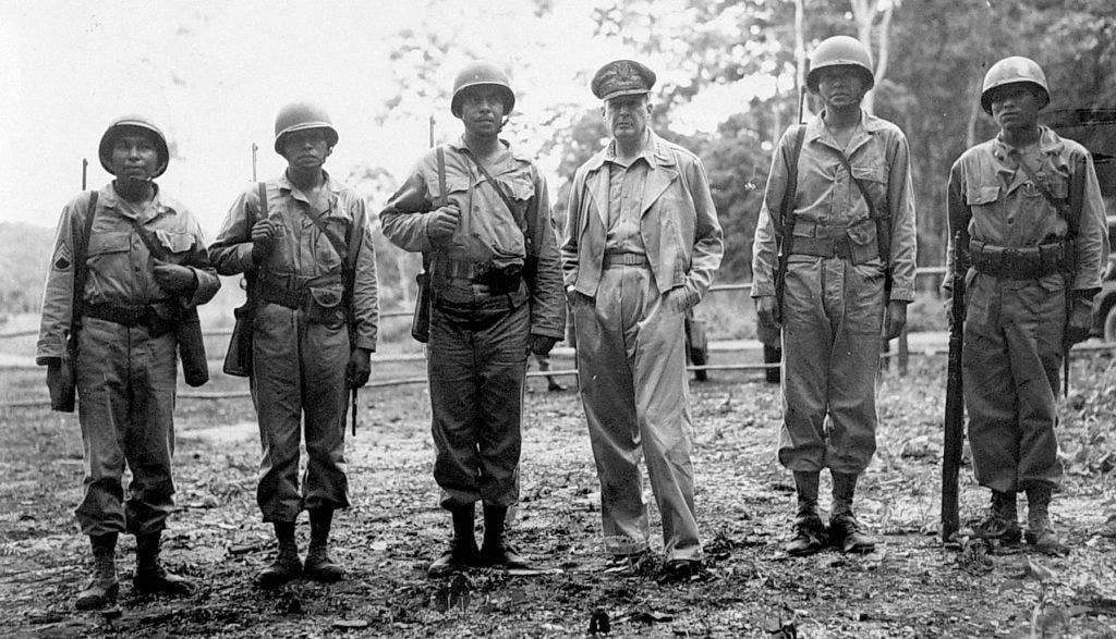 General Douglas MacArthur meets representatives of different American Indian tribes in the Alamo Scouts, representing the Pima, Pawnee, Chitimacha, and Navajo. (U.S. Army photo)