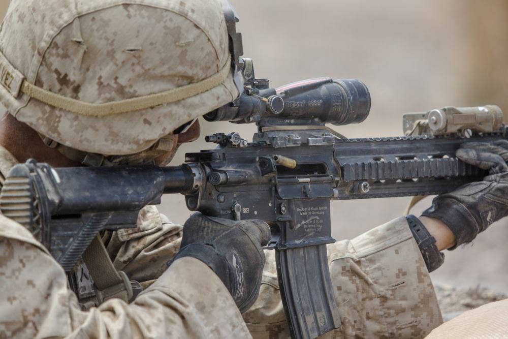 A U.S. Marine with Echo Company, 2nd Battalion, 5th Marine Regiment, 1st Marine Division, fires a M27 infantry automatic rifle at simulated enemies during an Integrated Training Exercise (ITX) at Marine Corps Air-Ground Combat Center Twentynine Palms, Calif. | U.S. Marine Corps photo by Lance Cpl. Danny Gonzalez