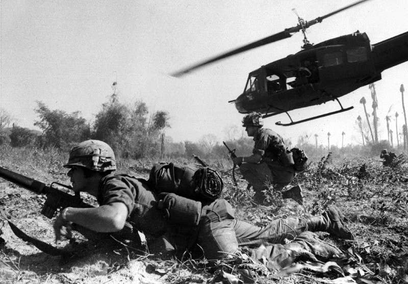 Combat operations at Ia Drang Valley, Vietnam, November 1965. Major Bruce P. Crandall's UH-1D helicopter climbs skyward after discharging a load of infantrymen on a search and destroy mission. (U.S. Army photo)