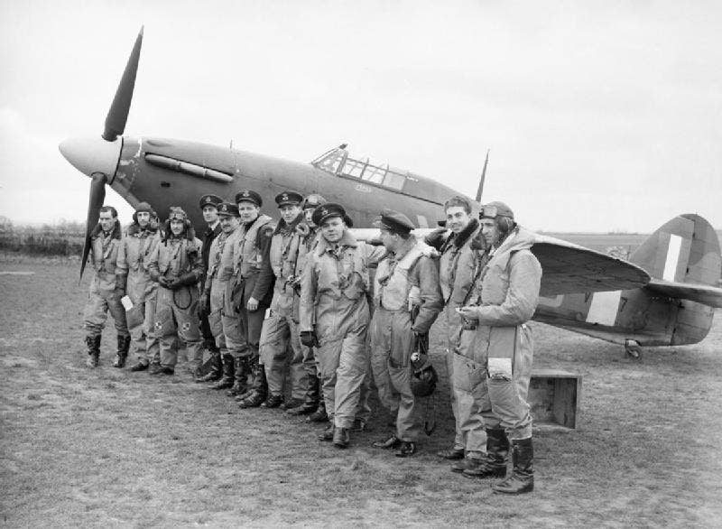 American pilots in the Royal Air Force pose in front of a Hawker Hurricane in 1941. (Photo: Imperial War Museums)