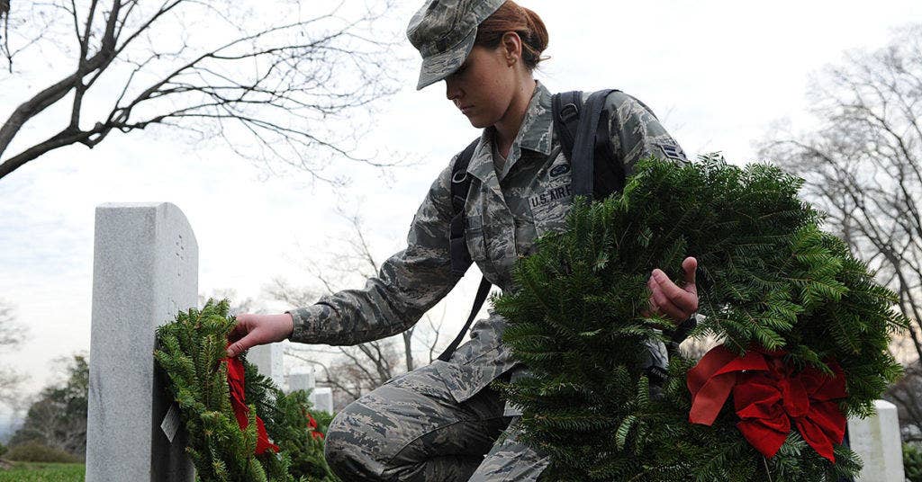 U.S. Air Force Airmen Erin O'Shea lays wreath on grave site at Arlington National Cemetary, Va., Dec. 15, 2012. (U.S. Air Force photo/ Airman 1st Class Nesha Humes)