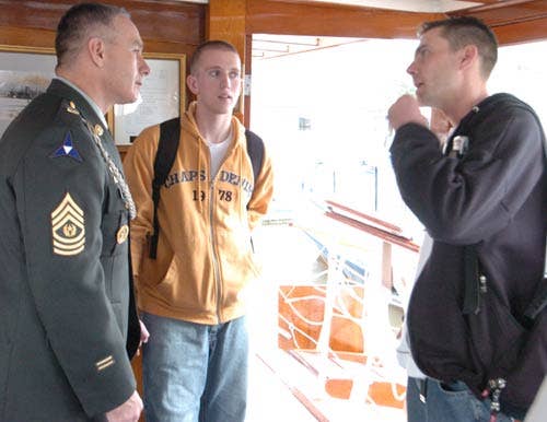 Senior Enlisted Adviser to the Chairman of the Joint Chiefs of Staff Army Sgt. Maj. William J. Gainey talks with wounded soldiers and their families on board the USS Sequoia on the way to Mount Vernon, Va., on Oct. 11, 2005. Gainey joined Marine Gen. Peter Pace, chairman of the Joint Chiefs of Staff, in presenting eight Purple Hearts to soldiers from Walter Reed Army Medical Center during a ceremony at Mount Vernon. (DOD photo)
