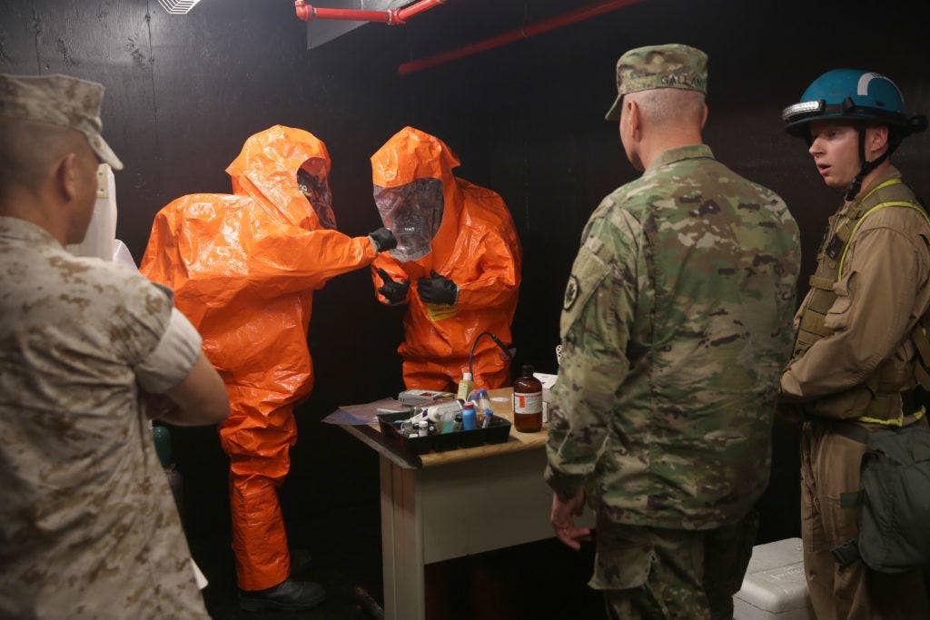 Marines with Identification and Detection Platoon, Chemical Biological Incident Response Force (CBIRF), show Army Maj. Gen. Richard Gallant, commander of Joint Task Force Civil Support, how they collect samples of chemical agents during an official visit at Naval Annex Stump Neck, Md., Sept. 29, 2016. (Photo: Marine Corps Sgt. Jonathan Herrera)