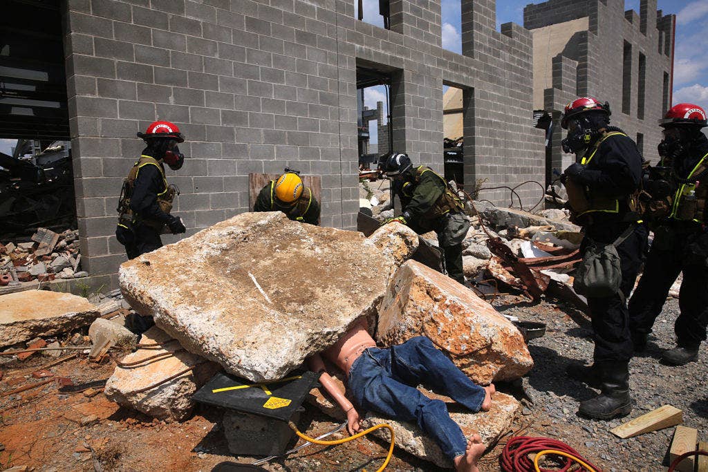 Marines with search and extraction and technical rescue platoons, Chemical Biological Incident Response Force, CBIIRF utilize high-pressure lifting air bags to remove rubble to free a simulated victim of a notional nuclear explosion during 48-hour operations as part of Exercise Scarlet Response 2016 at Guardian Centers, Perry, Ga., Aug. 25, 2016. (Photo: Marine Corps Lance Cpl. Maverick S. Mejia)