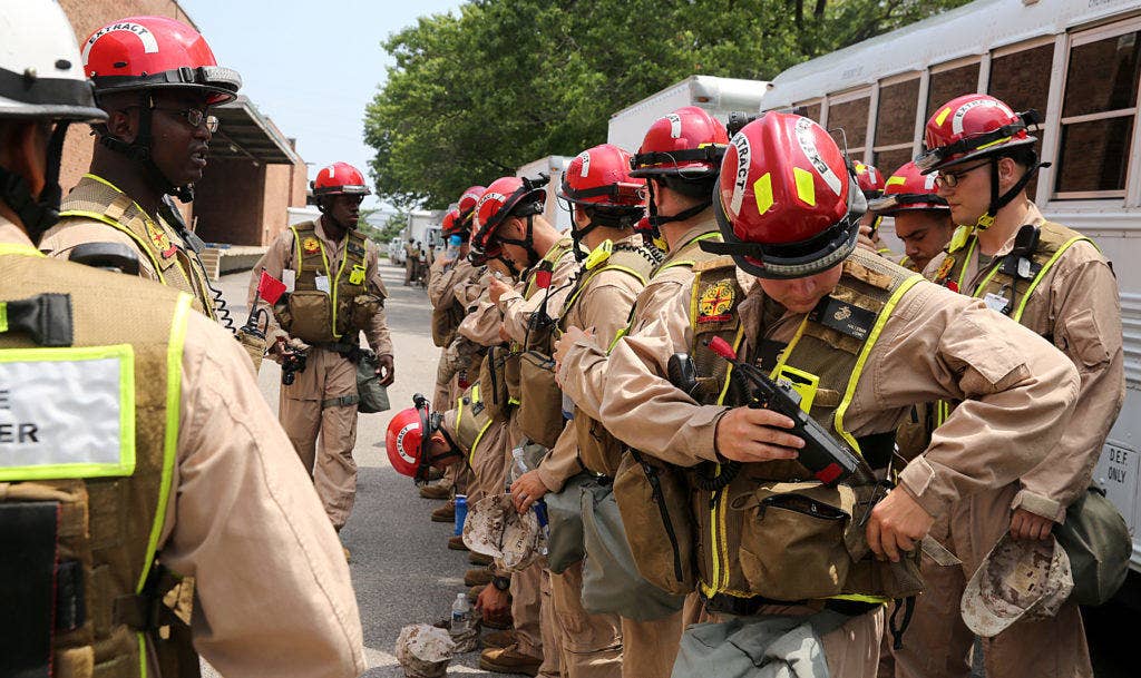 Marines from the search and extraction platoon, Chemical Biological Incident Response Force, CBIRF, line up for accountability after a deployment drill during Democratic National Convention, DNC, in Philadelphia, July 25, 2016. CBIRF's Marines and sailors worked alongside federal and local agencies to provide chemical, biological, radiological, nuclear and high-yield explosives, CBRNE, response capability for the Republican and Democratic National Conventions. (Photo: Marine Corps Lance Cpl. Maverick S. Mejia)