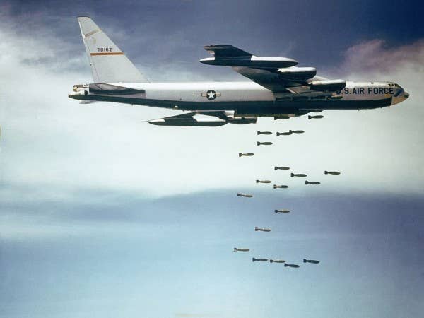 A U.S. Air Force Boeing B-52F Stratofortress drops bombs over Vietnam. (U.S. Air Force photo))