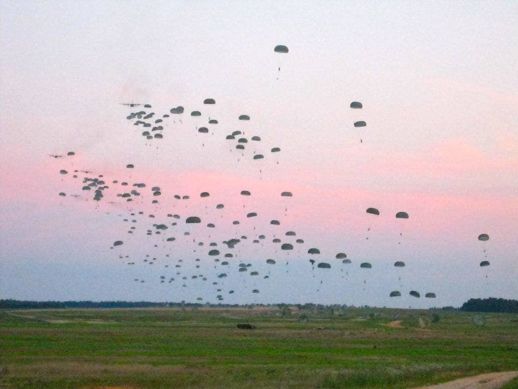 Waves of paratroopers fill the skies during a combat exercise. (U.S. Army)