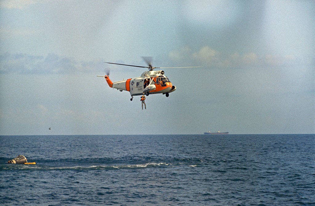 U.S. astronaut Frank Borman, Gemini 7 prime crew command pilot, is hoisted out of the water by a U.S. Coast Guard recovery team from a Sikorsky HH-52A Seaguard helicopter during water egress training in the Gulf of Mexico. (NASA photo)