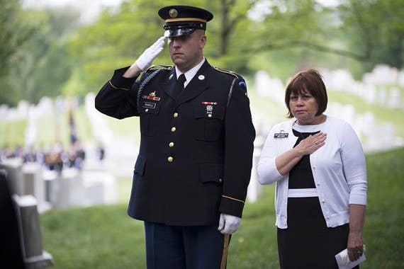 Army Arlington Lady Anne Lennox and her Old Guard escort salute as Taps is played and Brig. Gen. Henry G. Watson, the "father of the Fife and Drum Corps," is laid to rest at Arlington National Cemetery, May 14, 2014. (U.S. Army photo by Spc. Cody W. Torkelson)