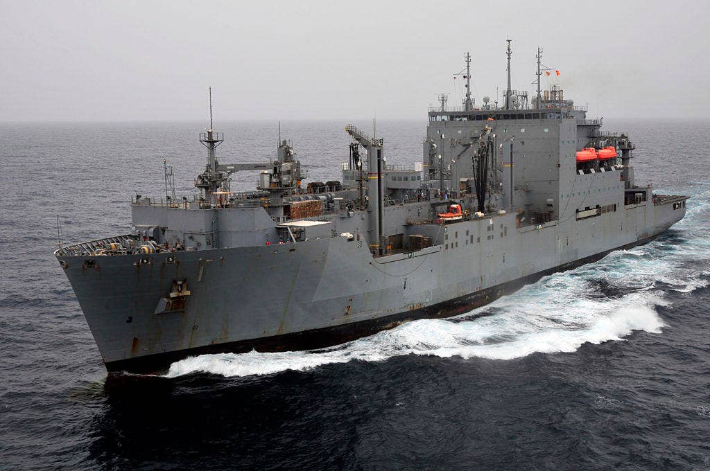 Hillary and the Dry Cargo Ship USNS Lewis and Clark have something in common. Neither were ever under sniper fire in Bosnia. (U.S. Navy photo)