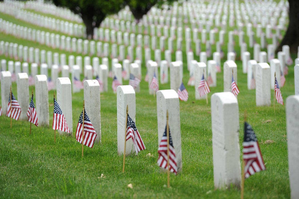American flags adorn the graves at Arlington. (U.S. Coast Guard photo by Petty Officer 2nd Class Patrick Kelley.
