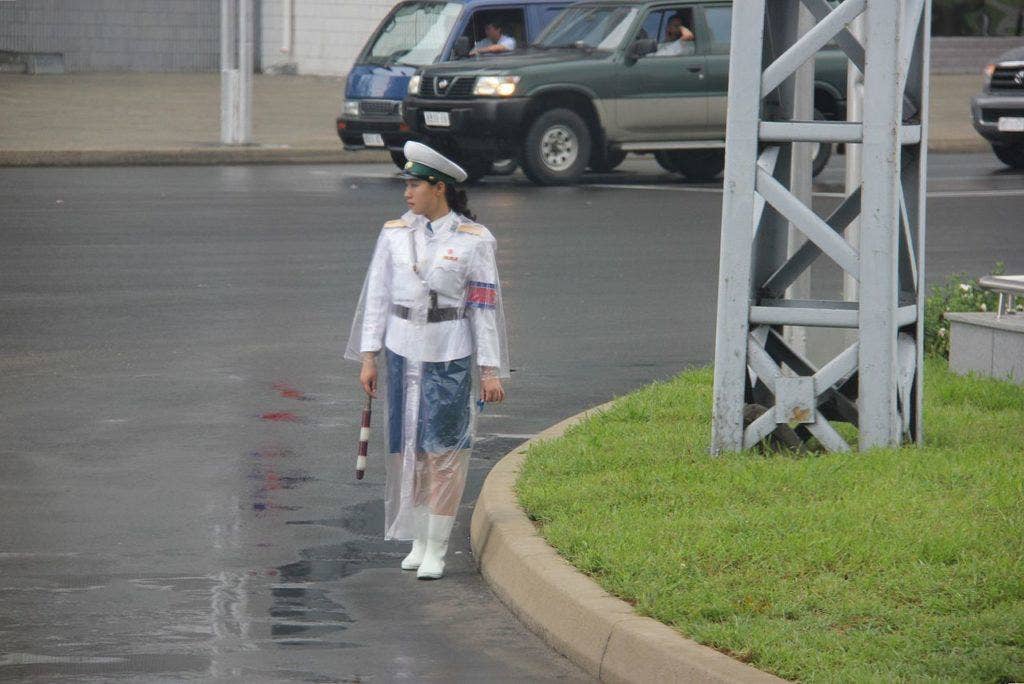 A Pyongyang traffic cop in the rain. (Photo from Wikimedia Commons)