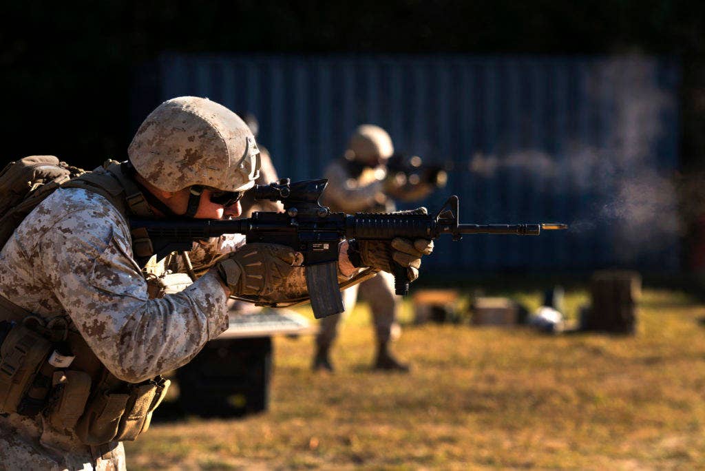 Sgt. Jeremy T. Wellenreiter, a primary marksmanship instructor with Weapons Training Battalion, fires an M-4 Carbine at Robotic Moving Targets at Marine Corps Base Quantico, Va. | U.S. Marine Corps photo by Cpl. Daniel Wetzel