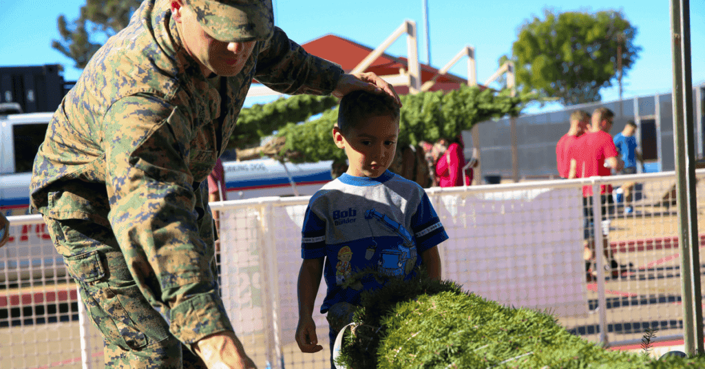 A Marine and his son pick out a Christmas tree during the Trees for Troops event aboard Marine Corps Air Station Miramar, Calif., Dec. 2.