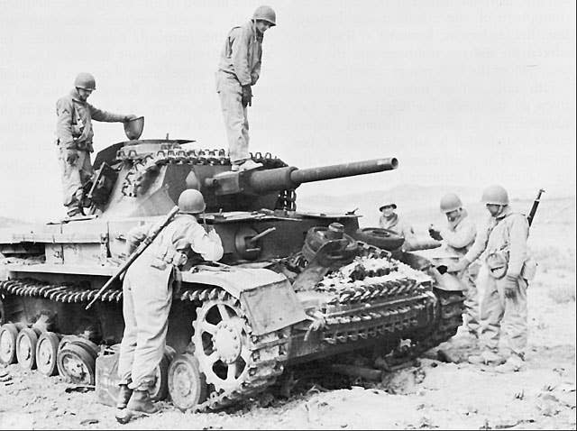 German Medium Tank Mk-IV knocked out by American artillery fire, Kasserine Pass. (U.S. Army photo)
