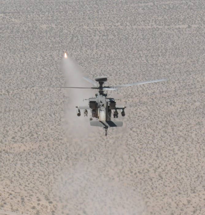 An Apache Longbow attack helicopter assigned to the 3rd Battalion, 501st Aviation Regiment, 1st AD Combat Aviation Brigade also known as 'Task Force Apocalypse', fires a Hellfire missile. Enemy troops on the receiving end of this missile will be unavailable for comment. (US Army photo by: Sgt. Aaron R. Braddy/Released)
