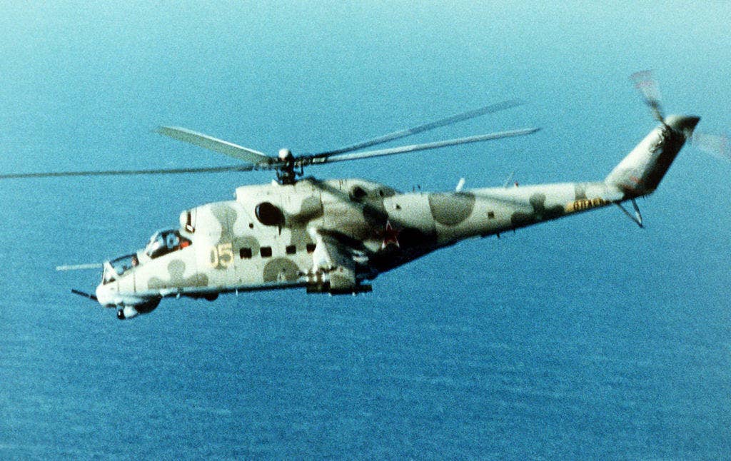 A left side view of a Soviet-made Mi-24 Hind-D assault helicopter in-flight. (DOD photo)