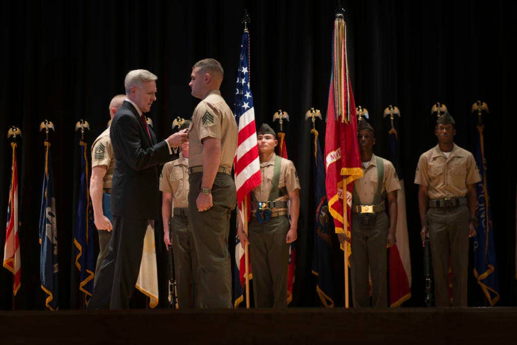 Sgt. Joshua Moore receives the Navy Cross from Secretary of the Navy Ray Mabus during a 2013 awards ceremony. (Photo: US Navy Mass Communication Specialist 1st Class Arif Patani)