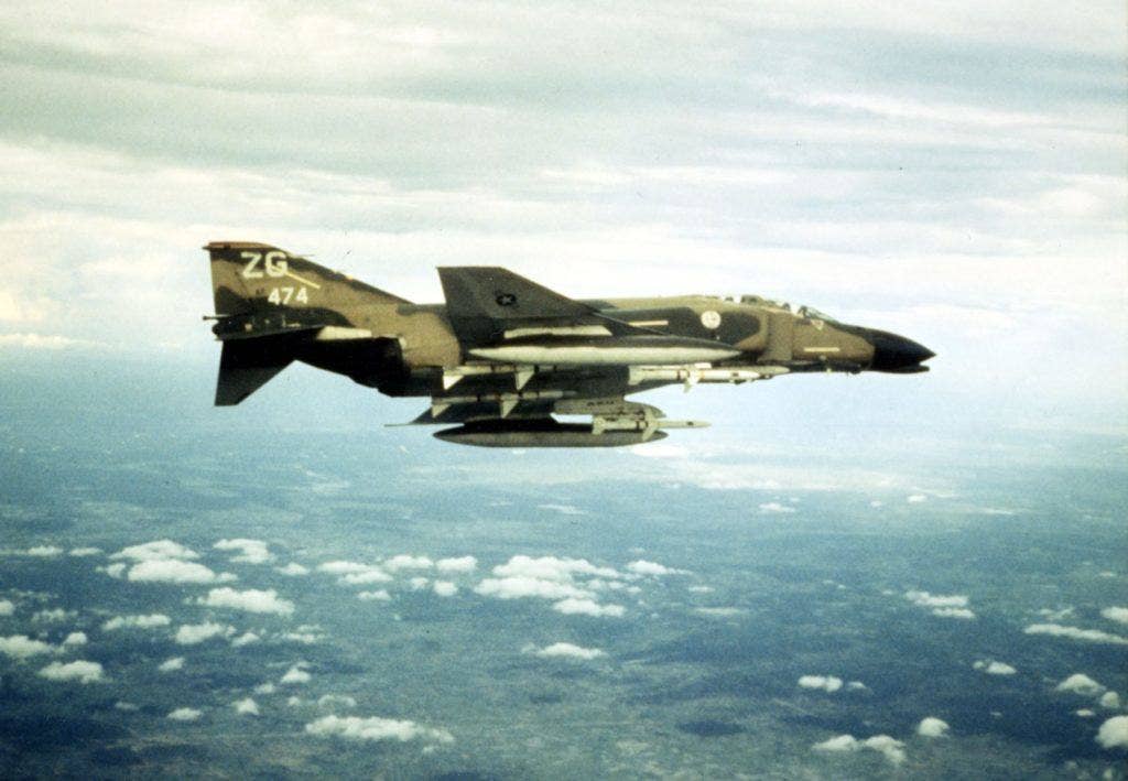 A U.S. Air Force McDonnell Douglas EF-4C Phantom II aircraft (s/n 63-7474) of the 67th Tactical Fighter Squadron, 18th Tactical Fighter Wing over North Vietnam in December 1972. | U.S. Air Force photo