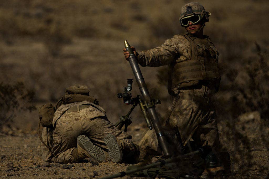 Mortars are basically a tube, a site, and a baseplate, so they can be assembled at the front and placed into operation quickly. In some situations, the tube can even be sighted by hand and fired without the baseplate, though both of these things reduce the accuracy. (Photo: U.S. Marine Corps Lance Cpl. Sarah N. Petrock)