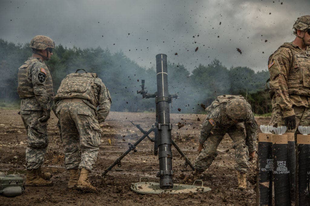 Because mortar rounds move at a lower rate than howitzer rounds, they require less propellant and generate less heat. This allows them to be fired more quickly. For instance, the M120 120mm mortar system can fire 16 rounds in its first minute and can sustain four rounds per minute. The M1911 howitzer can fire 12 rounds in two minutes and sustain three rounds per minute. (Photo: U.S. Army Spc. Patrick Kirby)