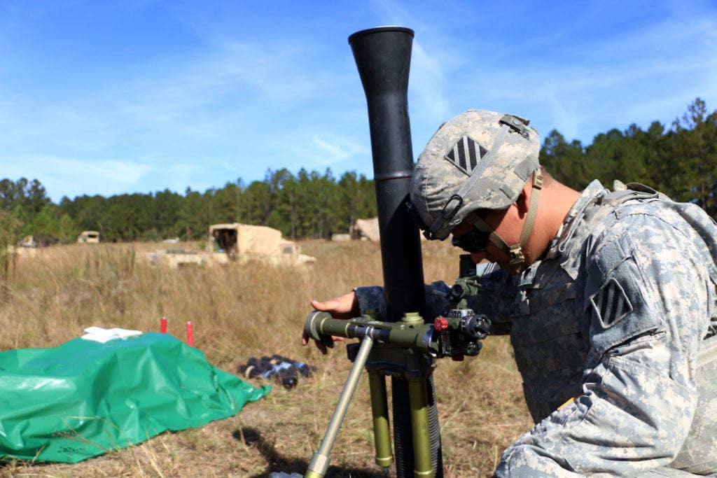 Mortars generally maneuver forward with the other infantrymen, meaning that they can see where their targets are and where they land. If necessary, the mortar can still fire from out of sight if a forward observer or other soldier provides targeting adjustments. (Photo: U.S. Army Spc. Joshua Petke)