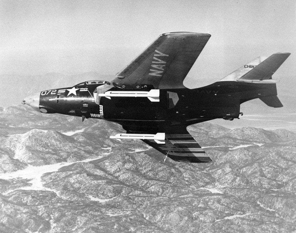 A F9F-8 Cougar with two AIM-9 Sidewinder missiles. Gene Cernan flew the F9F-8 during his time with VA-126. (U.S. Navy photo)