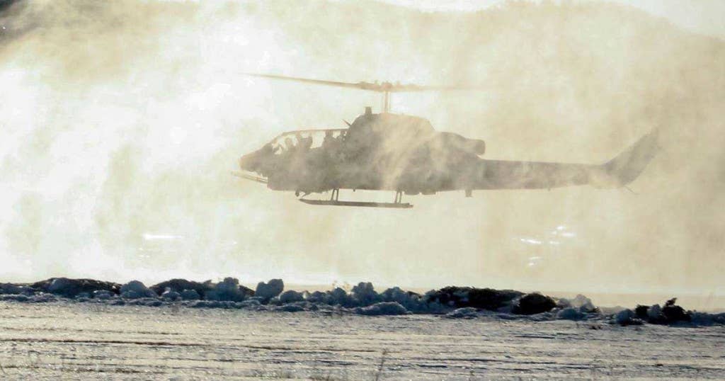 A U.S. Marine Corps AH-1W Super Cobra helicopter kicks up snow at Vaernes, Norway, Feb. 22, 2016, as 2nd Marine Expeditionary Brigade prepares for Exercise Cold Response. All aircraft with Marine Heavy Helicopter Squadron (-) Reinforced, the Air Combat Element of 2d MEB, were dismantled at Marine Corps Air Station Cherry Point, N.C., and flown to Norway in U.S. Air Force C-5 Galaxies to provide air support during the exercise. Cold Response 16 is a combined, joint exercise comprised of 12 NATO allies and partnered nations and approximately 16,000 troops. (U.S. Marine Corps photo by Cpl. Dalton A. Precht)
