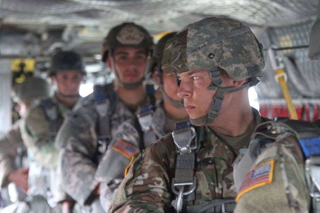 A paratrooper with Delta Company, 52nd Infantry Regiment (Long Range Surveillance), looks out of a window of a CH-47 Chinook helicopter before exiting at Rapido Drop Zone Sept. 1, 2016 at Fort Hood, Texas. This was the last jump before the unit's deactivation ceremony, which occurred Jan. 10, 2017. (Photo: U.S. Army Staff Sgt. Tomora Clark)