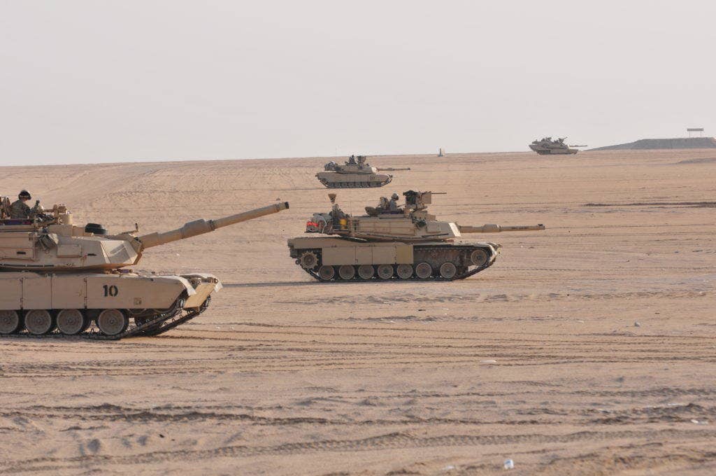 M1A2 Abrams Main Battle Tanks move to engage targets during a joint combined arms live-fire exercise near Camp Buehring, Kuwait Dec. 6-7, 2016. (Photo: U.S. Army Sgt. Aaron Ellerman)