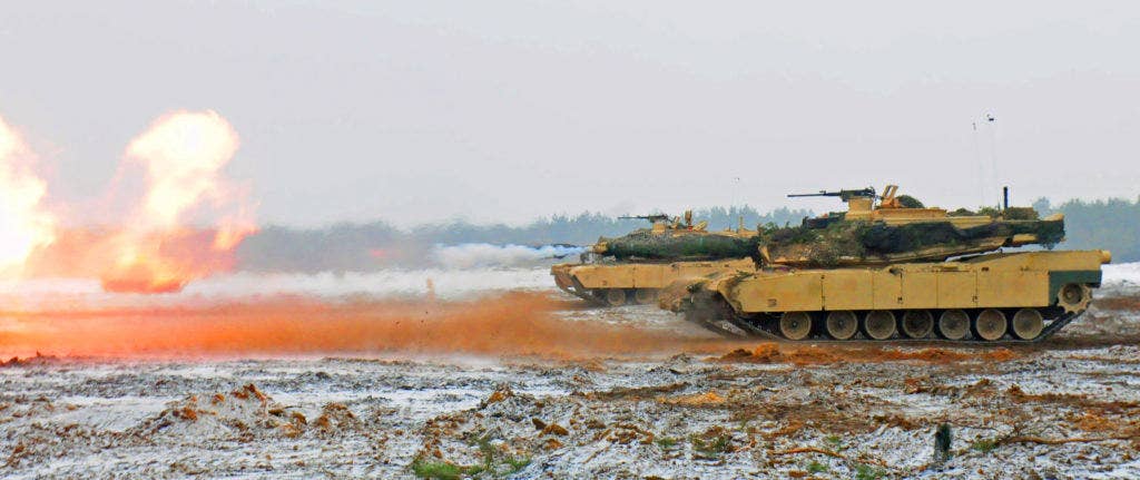 M1A2 Abrams Tanks belonging to 1st Battalion, 68th Armored Regiment, 3rd Armored Brigade, 4th Infantry Division fires off a round Jan. 26, 2017 during a gunnery range. (Photo: Department of Defense)