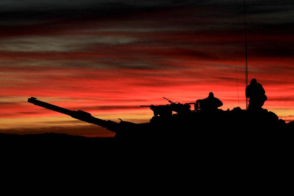 Marines from Company C, 1st Tank Battalion, prepare their tank for the day's attack on Range 210 Dec. 11, 2012, during Steel Knight 13.