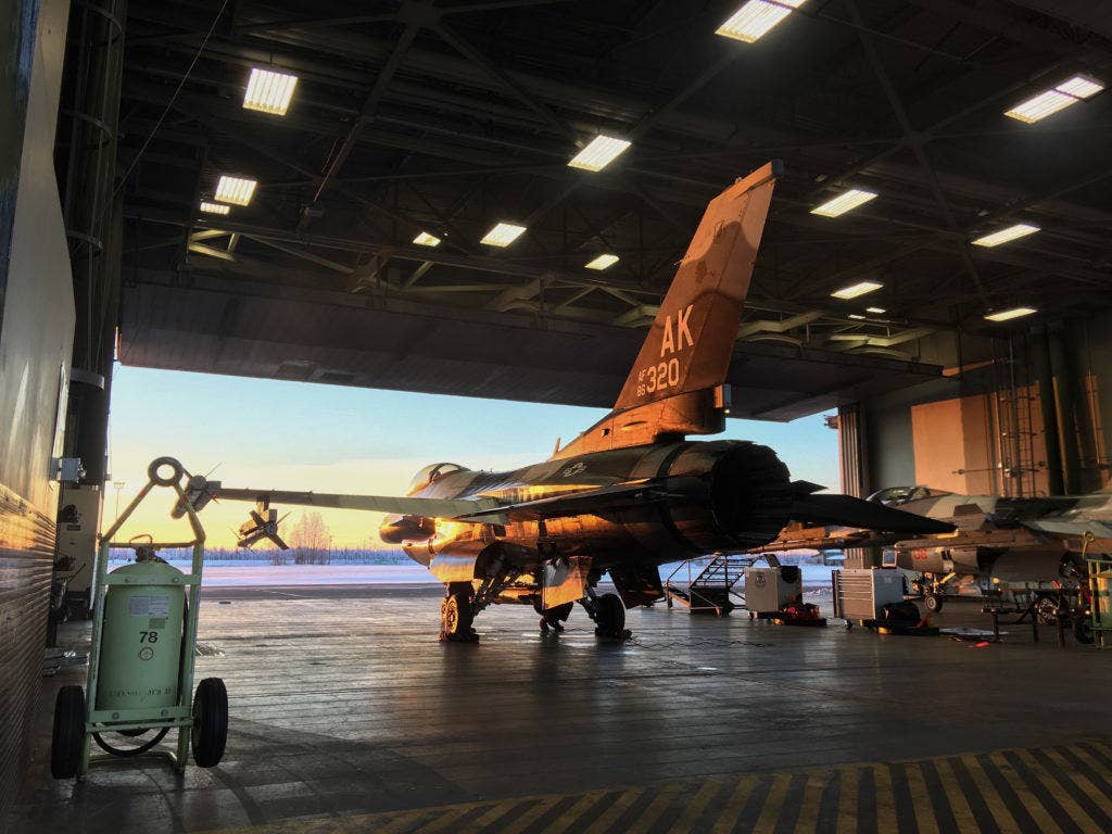 A U.S. Air Force F-16 Fighting Falcon aircraft is prepared for a training sortie Dec. 14, 2016, at Eielson Air Force Base, Alaska. The F-16 is assigned to the 354th Fighter Wing and flown by pilots from the 18th Aggressor Squadron and 353rd Combat Training Squadron during routine training, RED FLAG-Alaska and other exercises around the world. (U.S. Air Force photo by Staff Sgt. Shawn Nickel)
