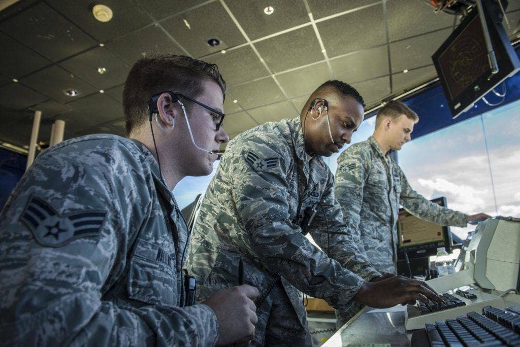 From left, U.S. Air Force Senior Airmen Robert Wallace, Anthony Marshall, and Eric Smith, all 354th Operations Support Squadron air traffic controllers, manage the air space around Eielson Air Force Base, Alaska, May 5, 2016, during RED-FLAG Alaska (RF-A) 16-1. Eielson air traffic controllers must know how to operate radio equipment to relay flight and landing instructions, weather reports and safety information to pilots. (U.S. Air Force photo by Staff Sgt. Joshua Turner)