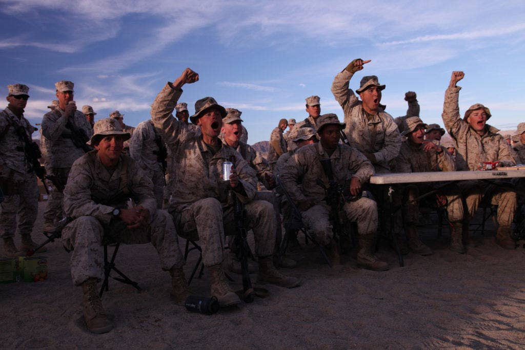 Marines with 3rd Battalion 4th Marine Regiment take a break from their Integrated Training Exercise to watch the Super Bowl at the Combat Center's Range 215, Feb. 3, 2012.